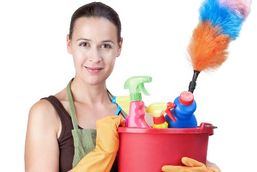 Professional Islington cleaners working in a modern home
