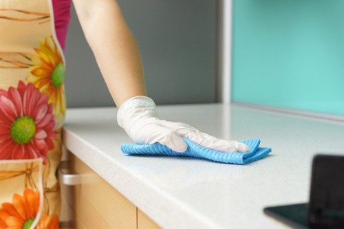 Cleaning team working safely with protective equipment in a property
