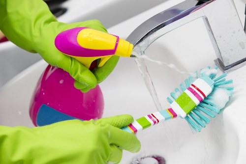 Cleaner in Islington handling deep cleaning tasks in a home
