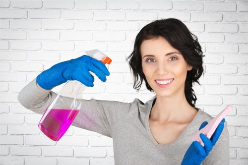 Cleaner wearing PPE while carrying out a risk-aware cleaning task